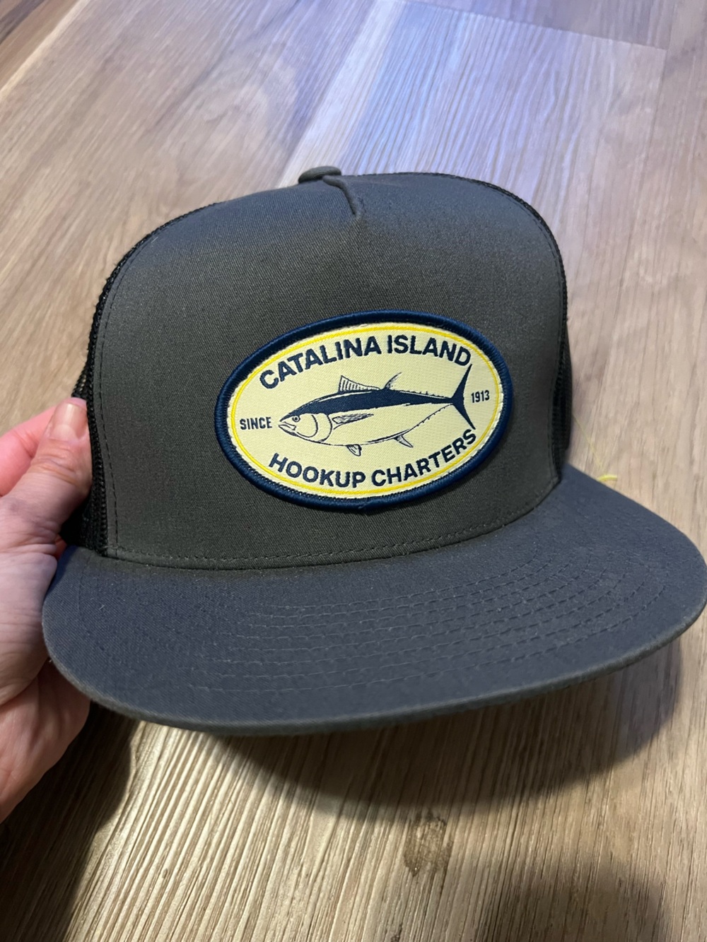 The Classic Gray Trucker Hat with Yellow Navy Fishing Patch